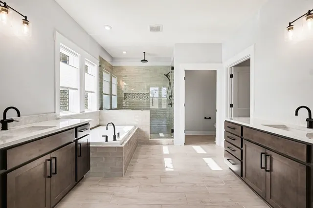 a bathroom with a tub and a window