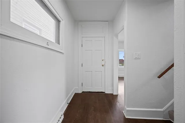 a view of an empty room with stairs