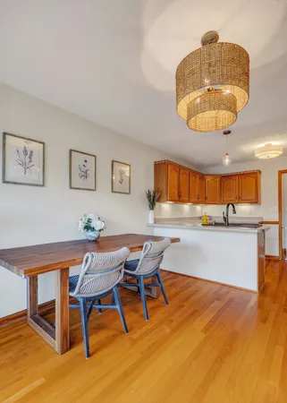 a view of a dining room with furniture and wooden floor