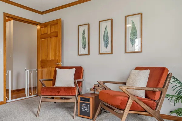 a reading room with furniture and a window