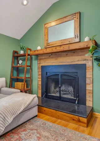 a bedroom with a bed and a tv on wall