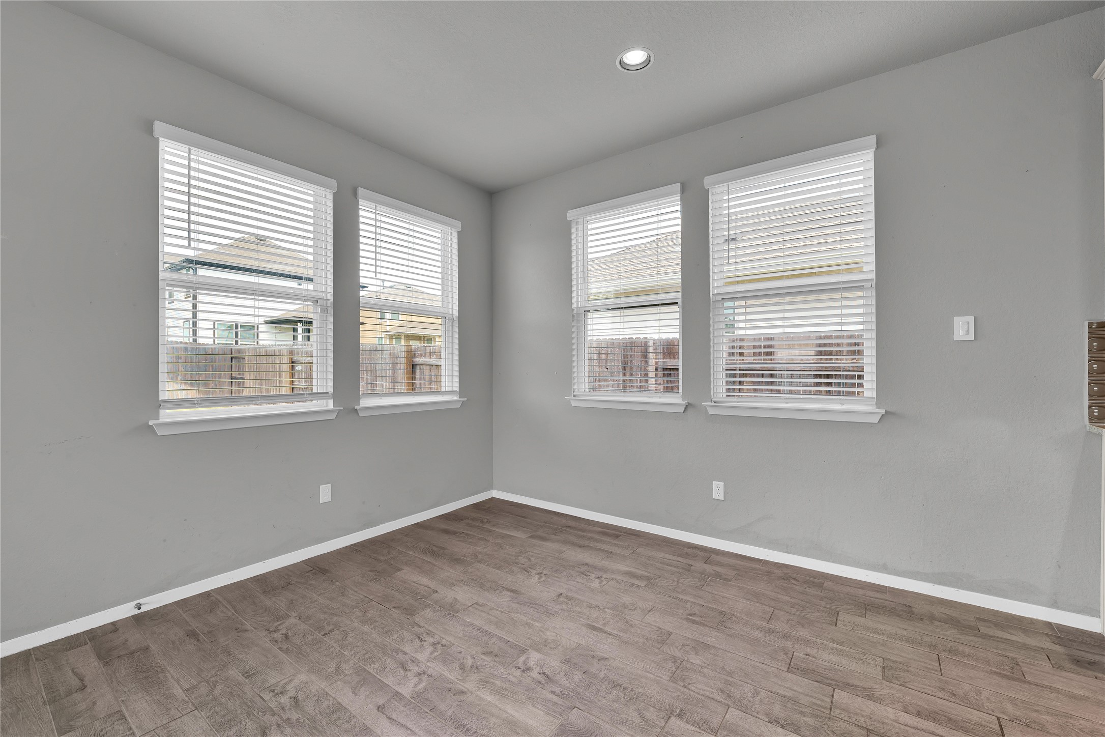 101 Crescent Street Georgetown, TX 78626 - Photo 14 of 39 Dining area features rich wood flooring and well-lit windows, perfect for everyday meals.
