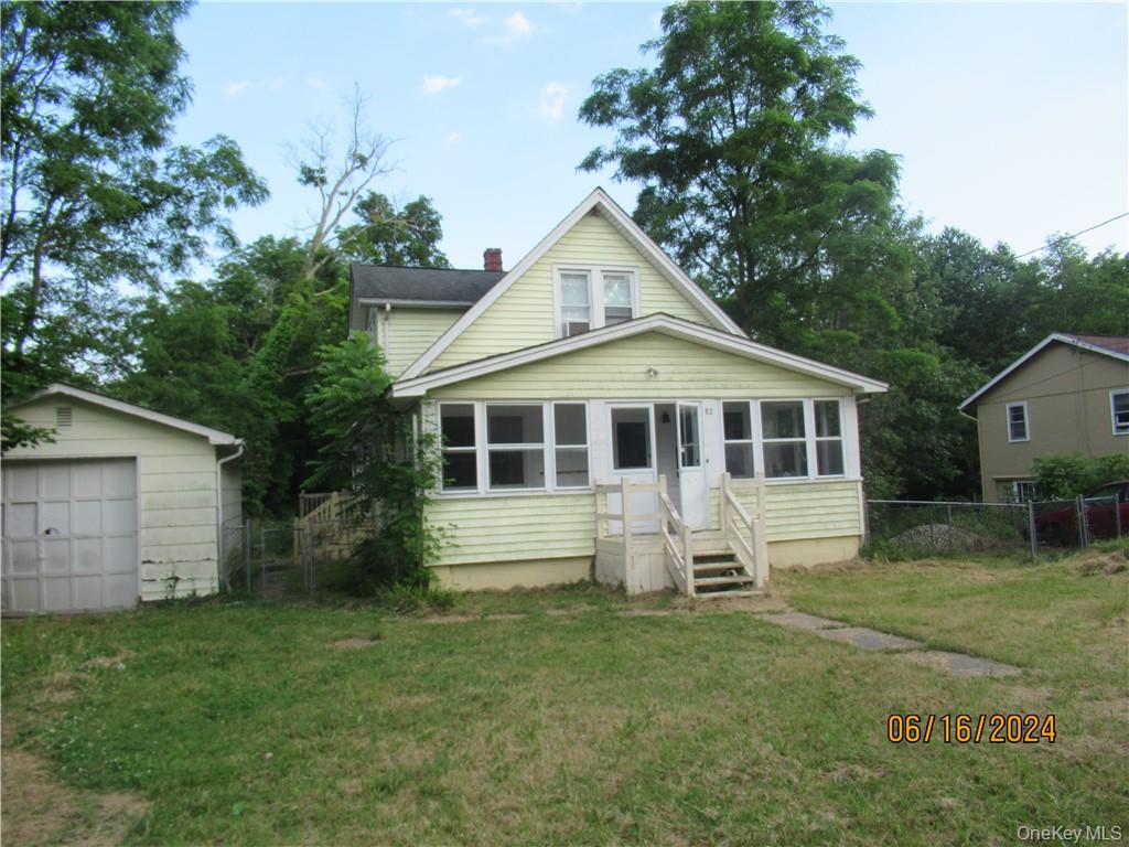 Front of house with a lawn