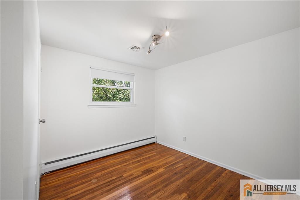 21 Eardley Road Edison, NJ 08817 - Photo 17 of 40 wooden floor in an empty room