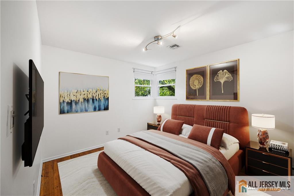 21 Eardley Road Edison, NJ 08817 - Photo 19 of 40 a bedroom with a bed and a flat screen tv