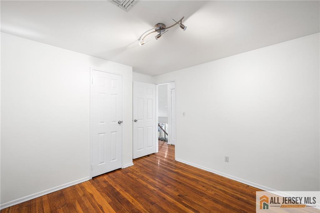 21 Eardley Road Edison, NJ 08817 - Photo 21 of 40 a view of empty room with wooden floor