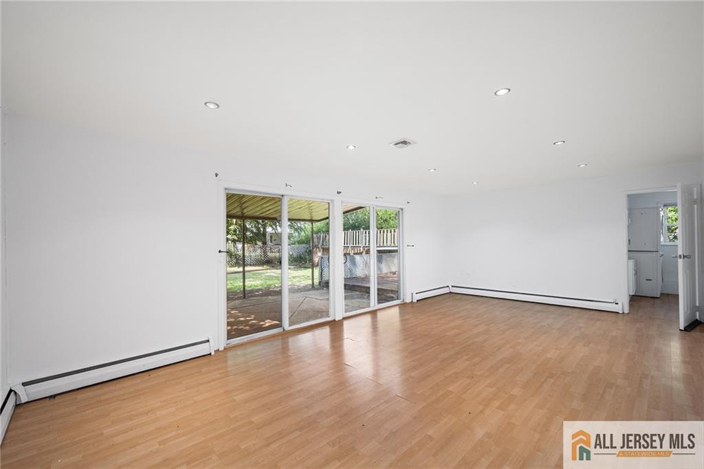 21 Eardley Road Edison, NJ 08817 - Photo 23 of 40 an empty room with wooden floor and windows