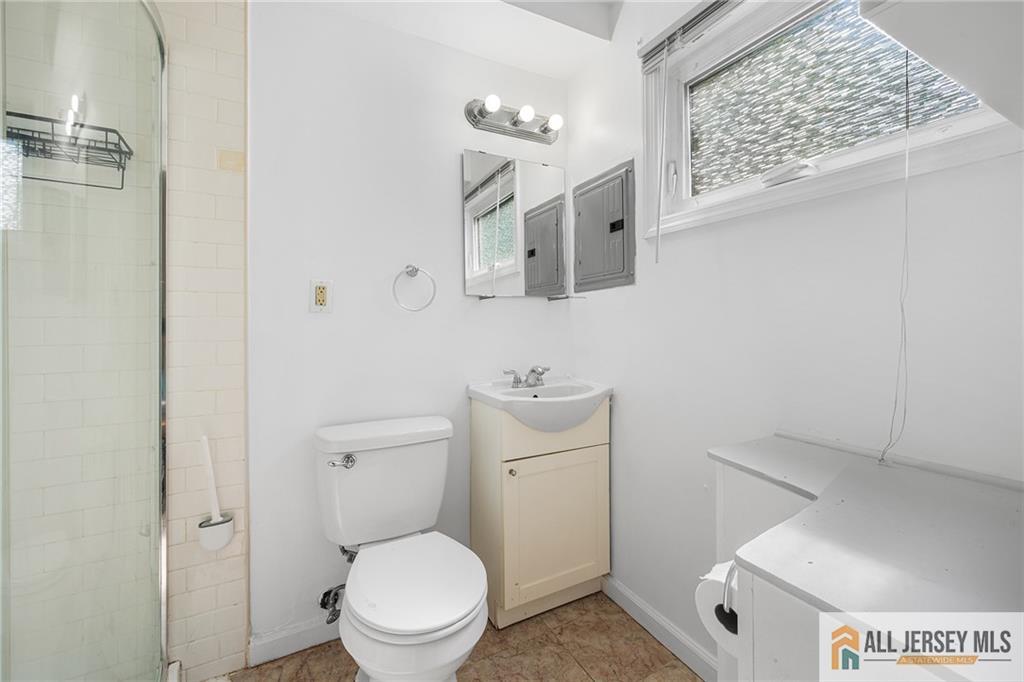 21 Eardley Road Edison, NJ 08817 - Photo 28 of 40 a white toilet sitting next to a bathroom sink