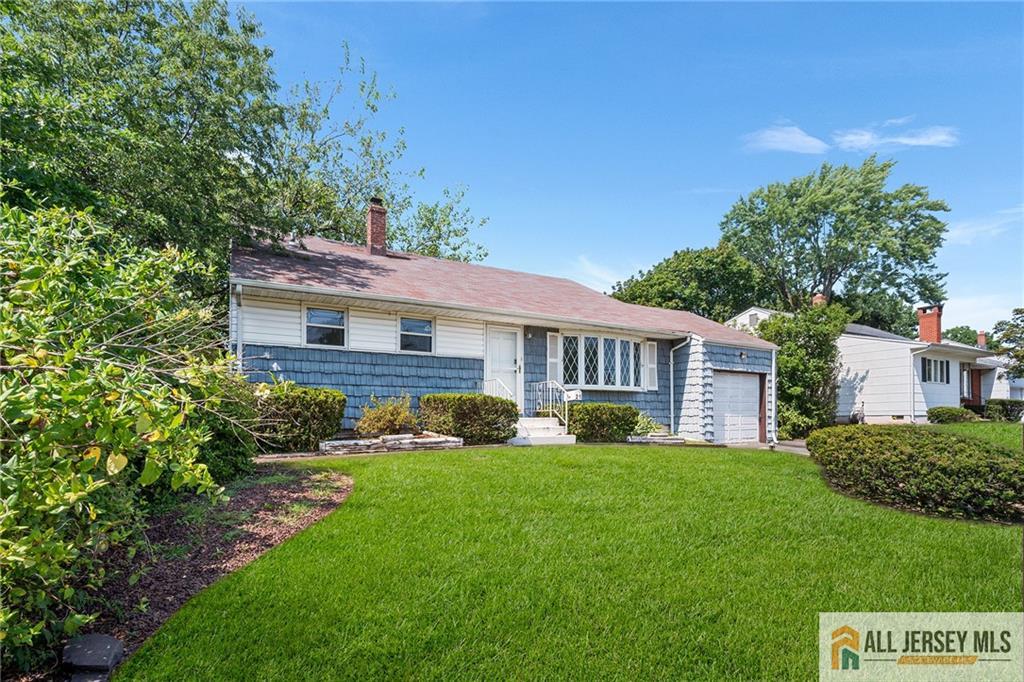 21 Eardley Road Edison, NJ 08817 - Photo 3 of 40 a front view of a house with a yard