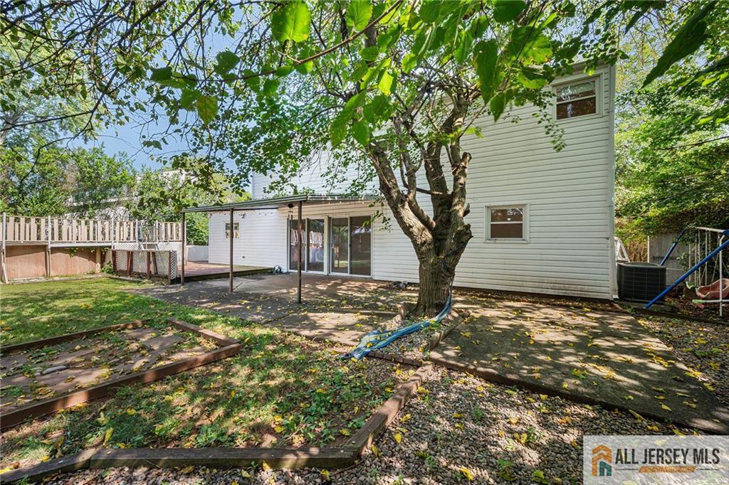 21 Eardley Road Edison, NJ 08817 - Photo 35 of 40 a house with trees in front of it