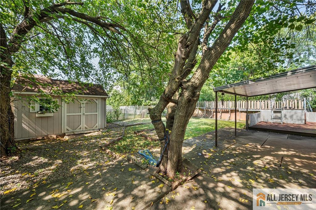 21 Eardley Road Edison, NJ 08817 - Photo 38 of 40 a view of a yard with plants and large trees