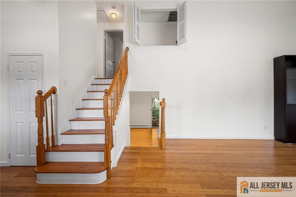 21 Eardley Road Edison, NJ 08817 - Photo 5 of 40 a view of entryway and hall with wooden floor