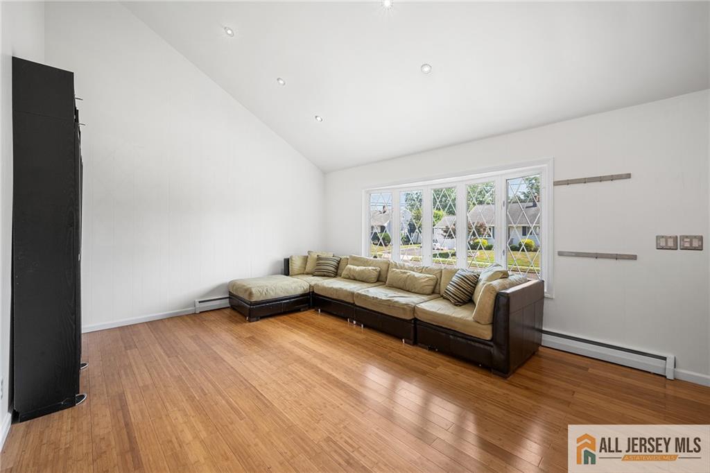 21 Eardley Road Edison, NJ 08817 - Photo 7 of 40 a living room with furniture and a wooden floor