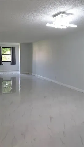 a view of a kitchen with a closet and mirror