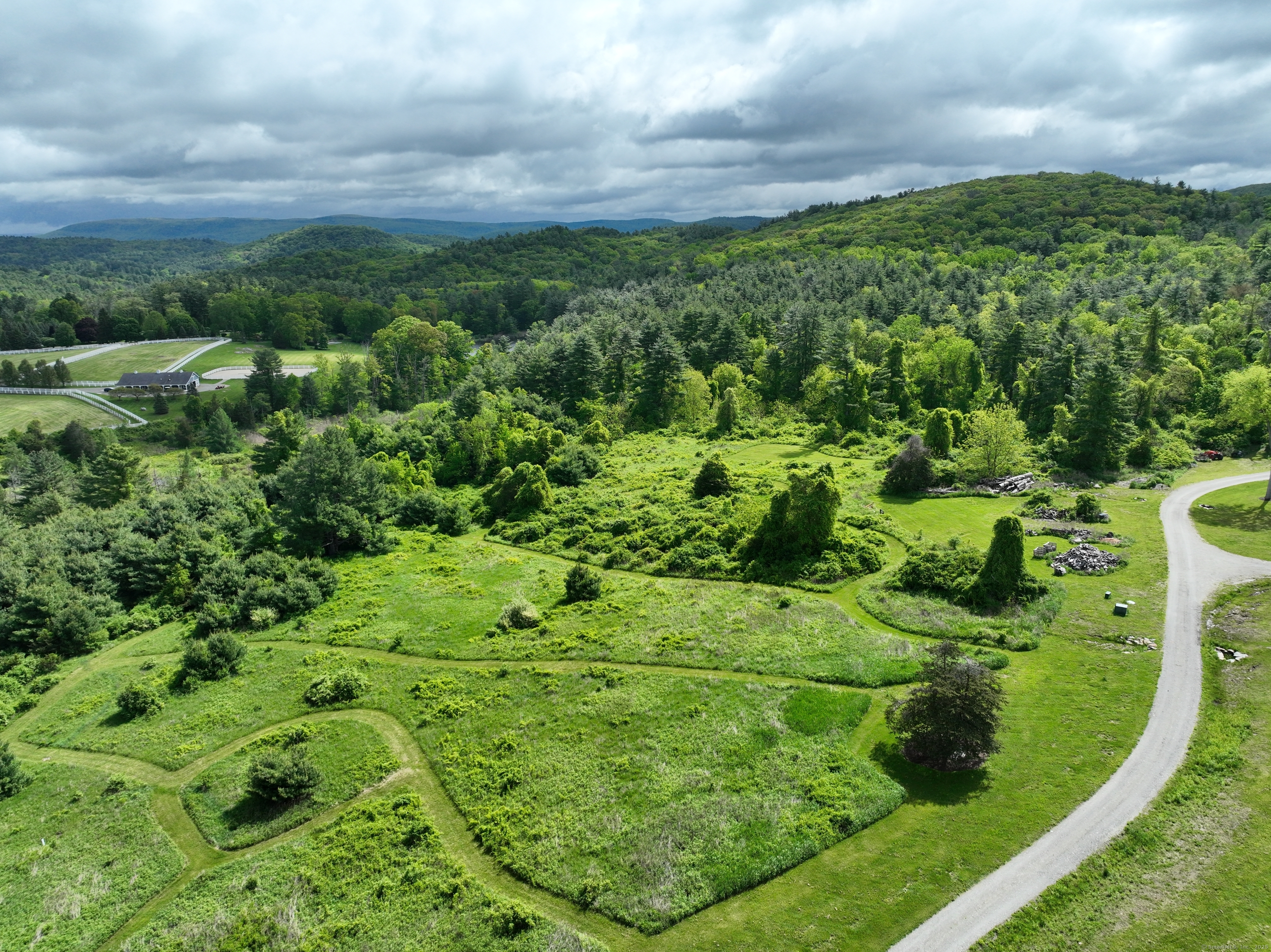 10 Red Mountain Road Salisbury, CT 06039 - Photo 5 of 7 a view of a garden with a building in the background