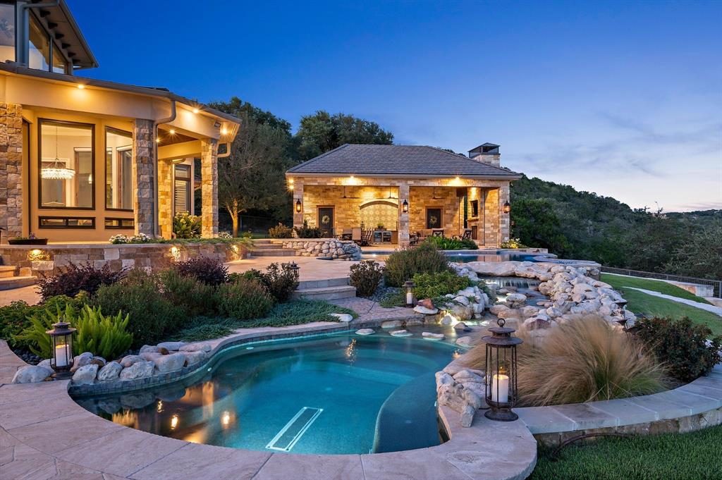325 River Ridge Spring Branch, TX 78070 - Photo 7 of 40 a view of a swimming pool with a patio
