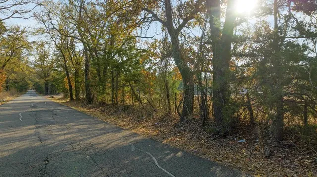 a view of a field with an ocean view