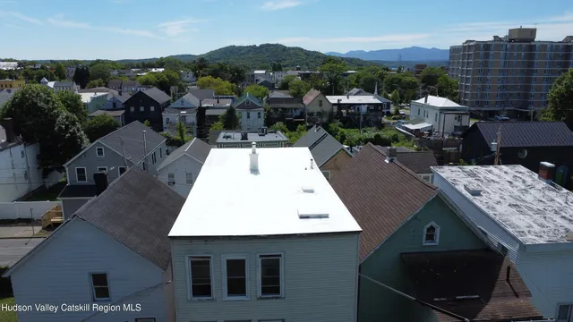 an aerial view of a residential apartment building with a yard