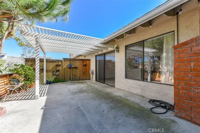 a view of a patio with table and chairs and potted plants