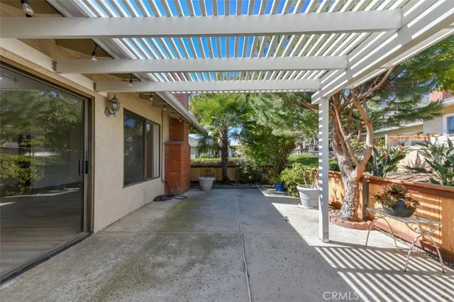 a view of a house with porch and garden