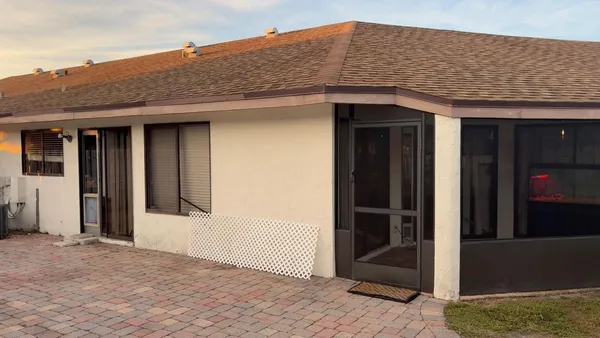 a view of a car parked in front of a house