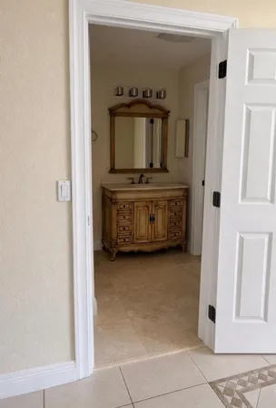 a kitchen with granite countertop cabinets sink and window