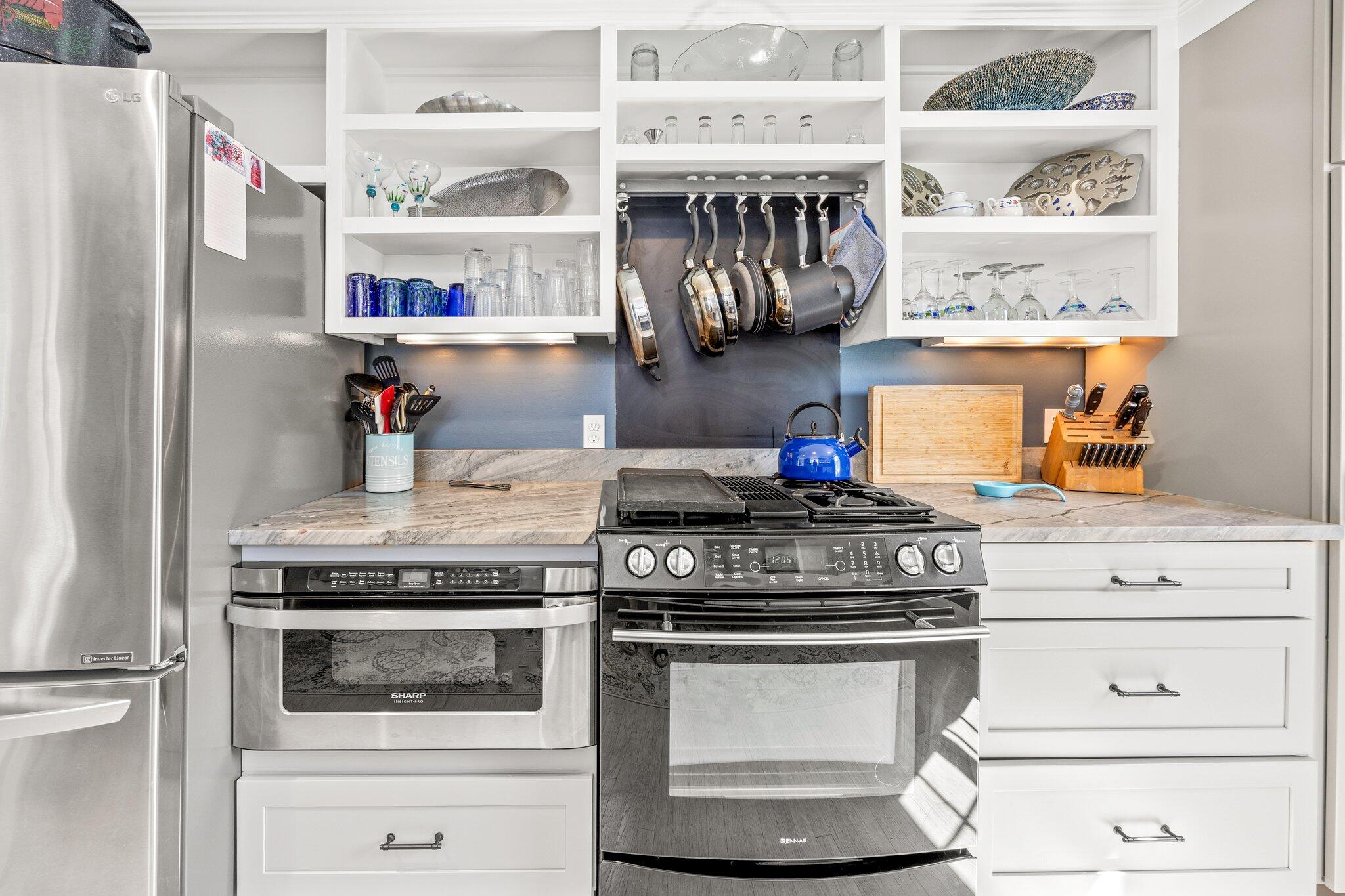 80 Hiram Pond Road Dennis, MA 02638 - Photo 13 of 82 a kitchen with stainless steel appliances granite countertop a stove and a refrigerator