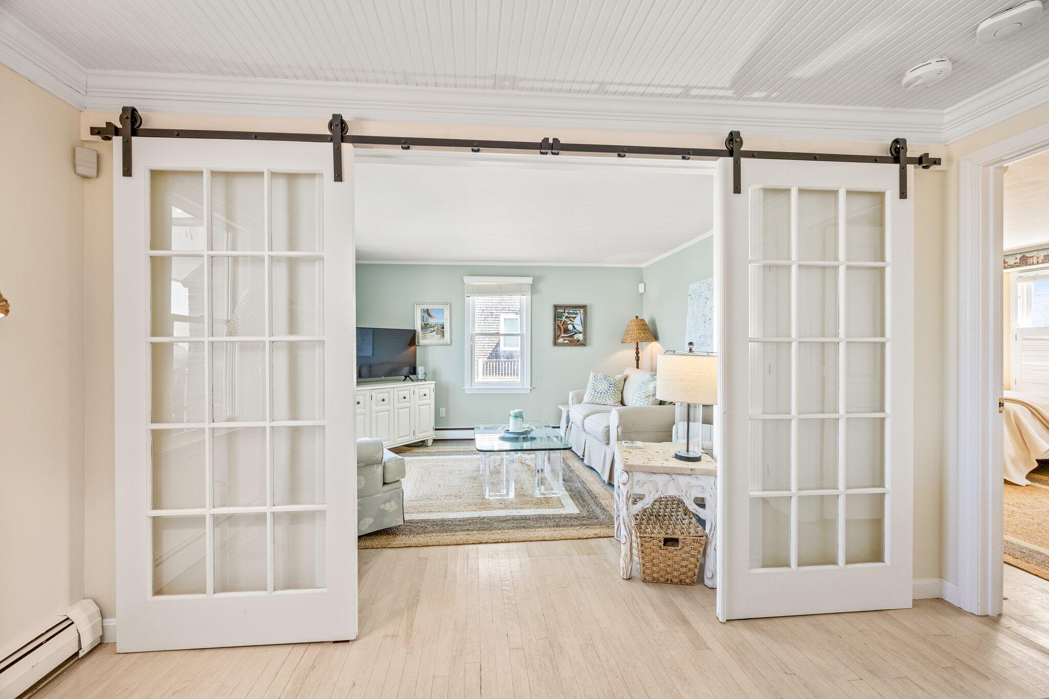 80 Hiram Pond Road Dennis, MA 02638 - Photo 16 of 82 a living room with furniture and a window