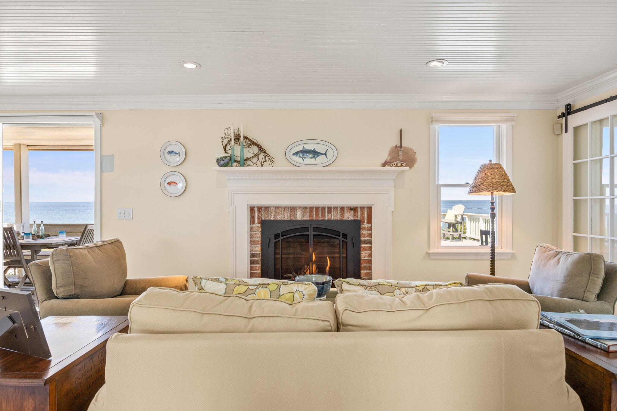 80 Hiram Pond Road Dennis, MA 02638 - Photo 20 of 82 a living room with furniture and a fireplace