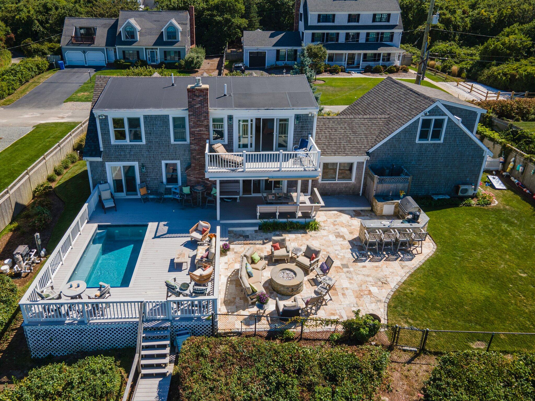 80 Hiram Pond Road Dennis, MA 02638 - Photo 2 of 82 an aerial view of a house with swimming pool and outdoor seating