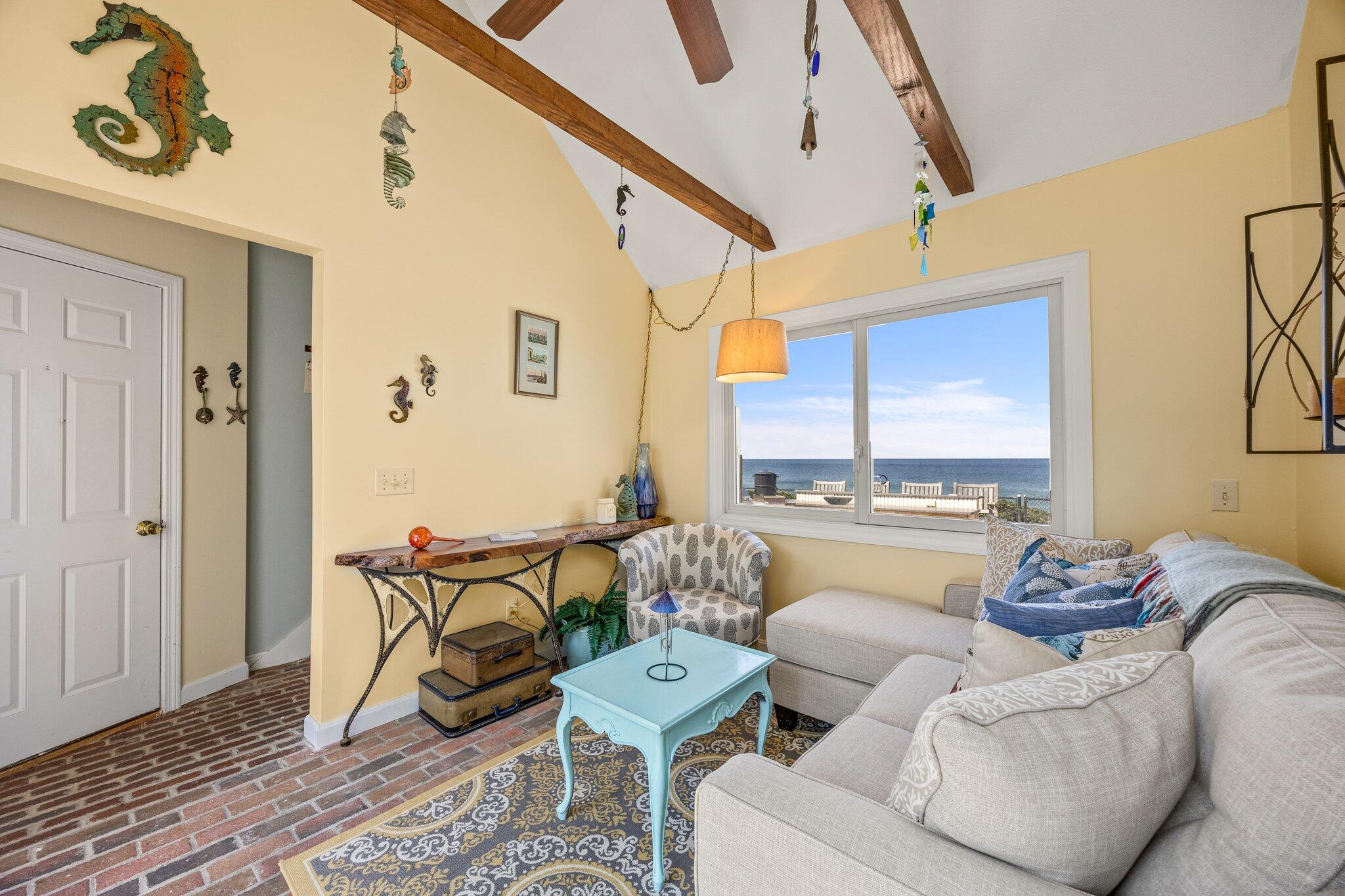 80 Hiram Pond Road Dennis, MA 02638 - Photo 38 of 82 a living room with furniture and a table