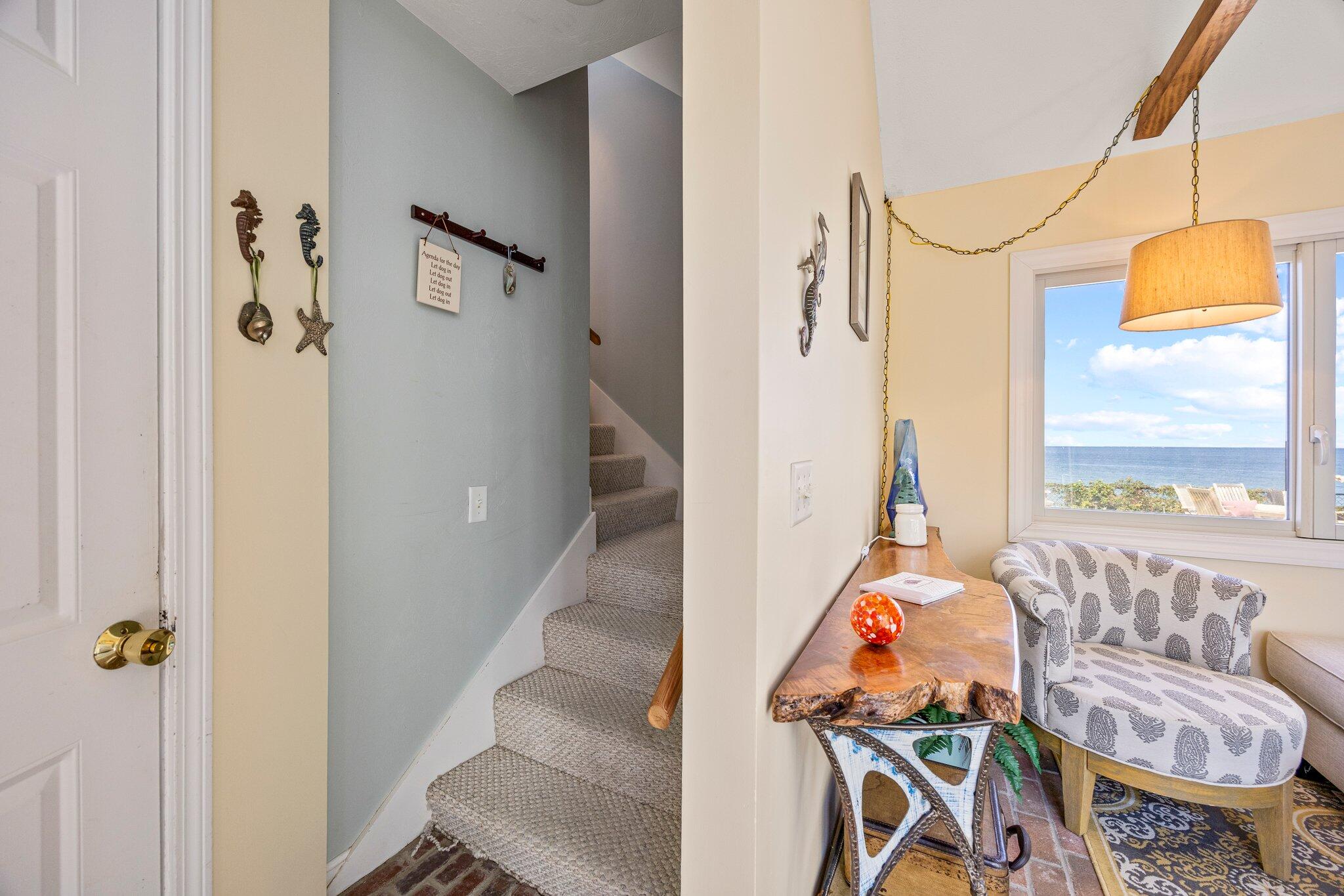 80 Hiram Pond Road Dennis, MA 02638 - Photo 39 of 82 a view of a hallway with furniture and windows