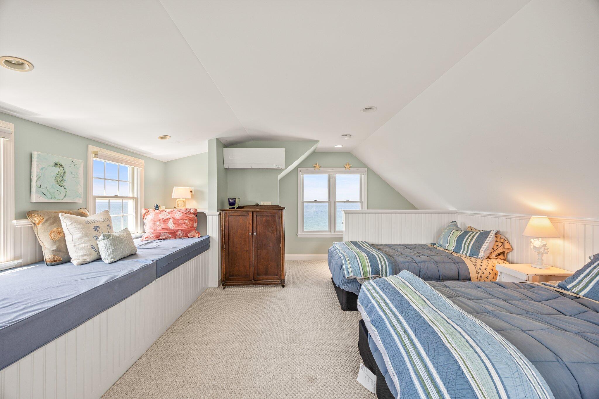 80 Hiram Pond Road Dennis, MA 02638 - Photo 41 of 82 a bedroom with a large bed and a large window