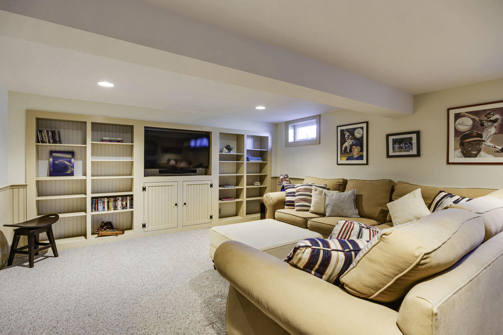 80 Hiram Pond Road Dennis, MA 02638 - Photo 44 of 82 a living room with furniture and a flat screen tv