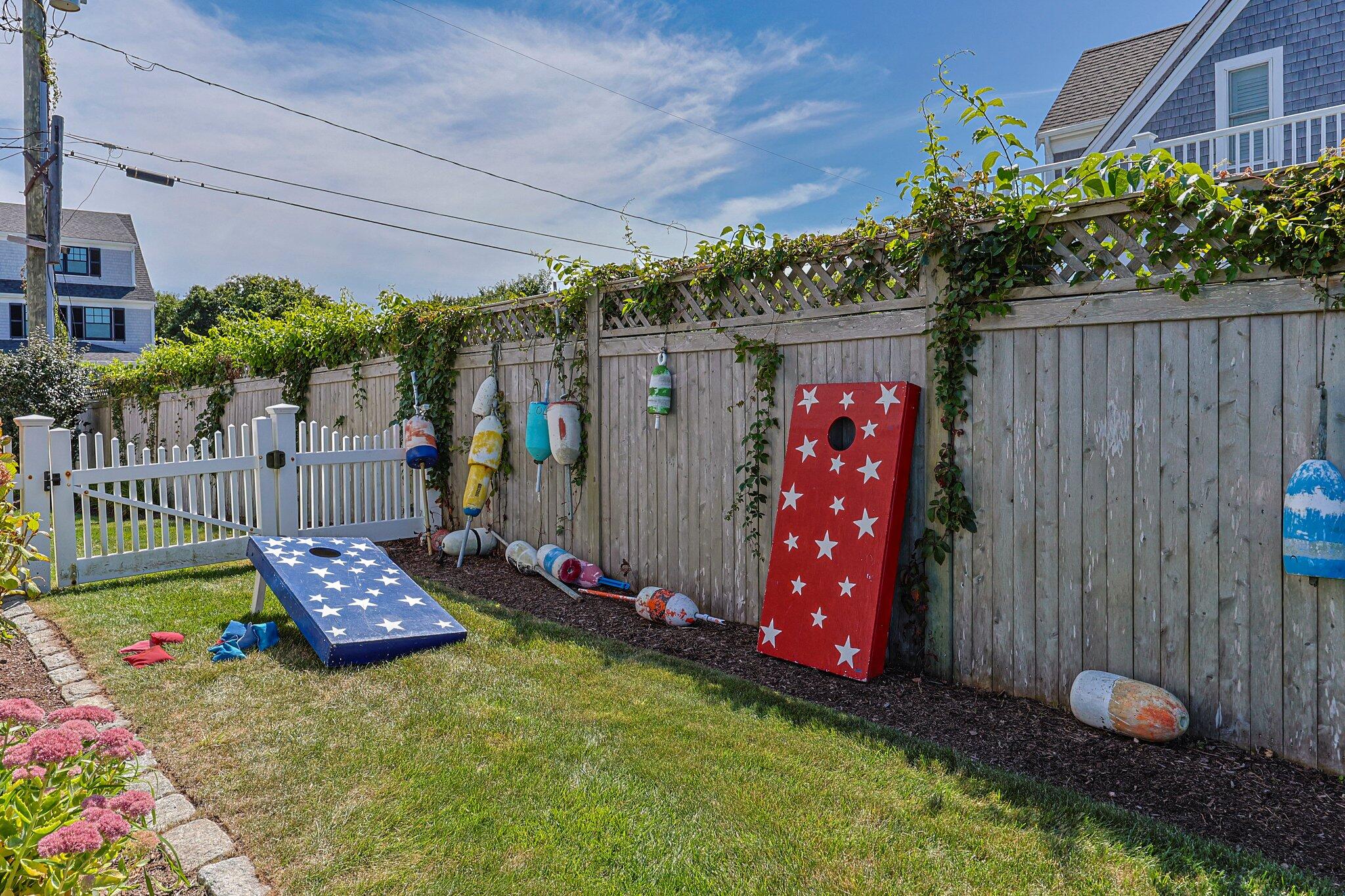 80 Hiram Pond Road Dennis, MA 02638 - Photo 51 of 82 a wooden bench sitting in front of a building