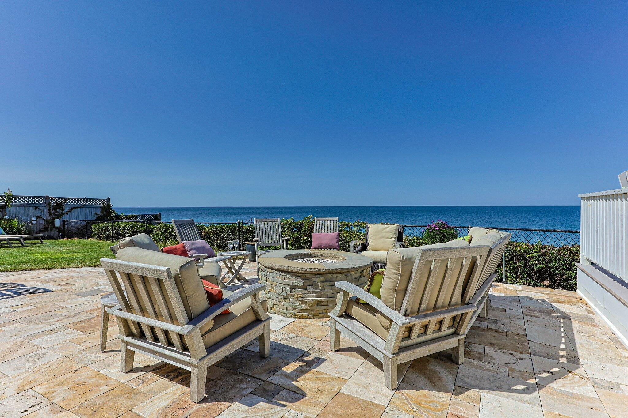 80 Hiram Pond Road Dennis, MA 02638 - Photo 56 of 82 a view of a patio with a table and chairs