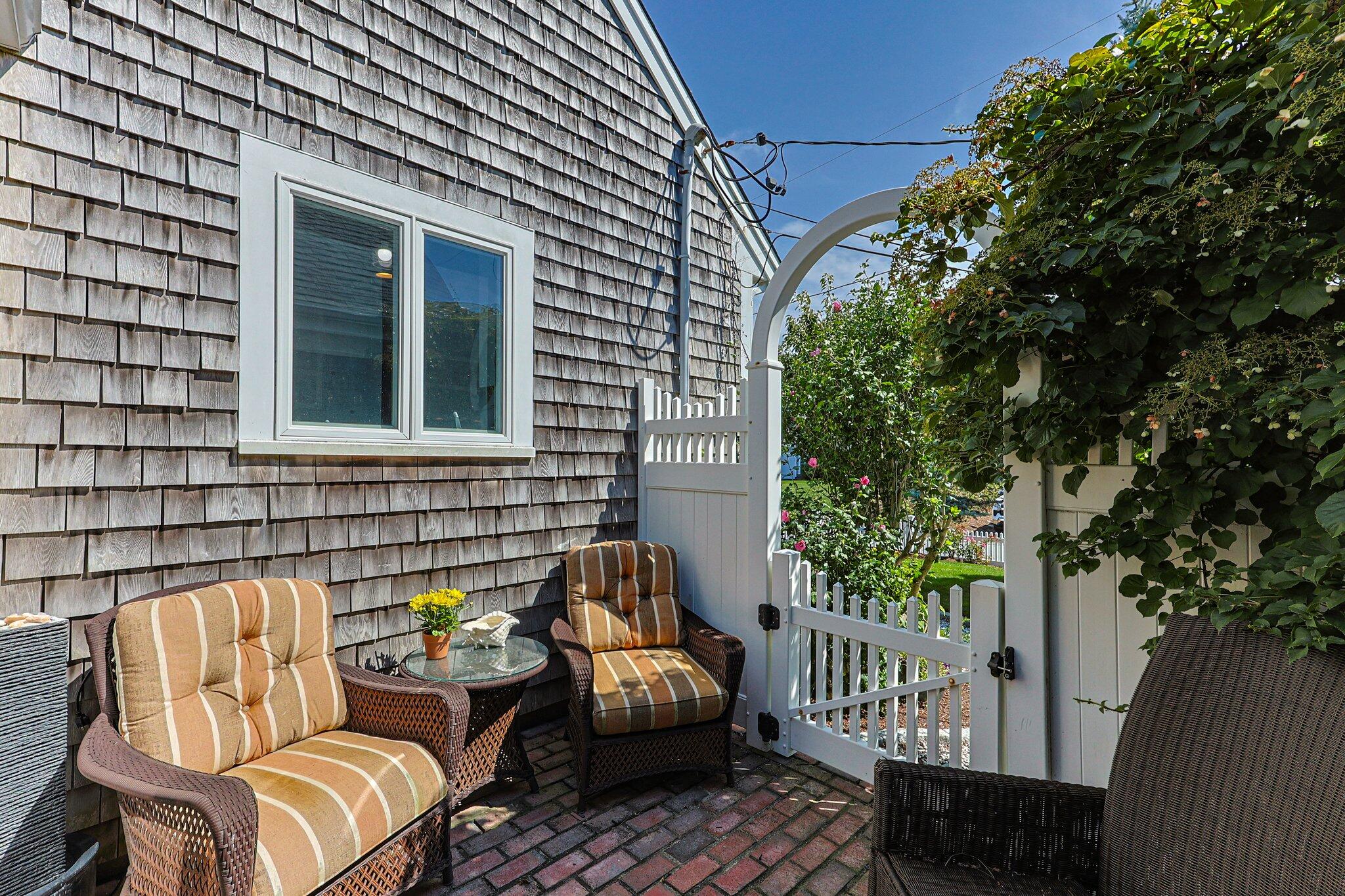 80 Hiram Pond Road Dennis, MA 02638 - Photo 6 of 82 a backyard of a house with seating space