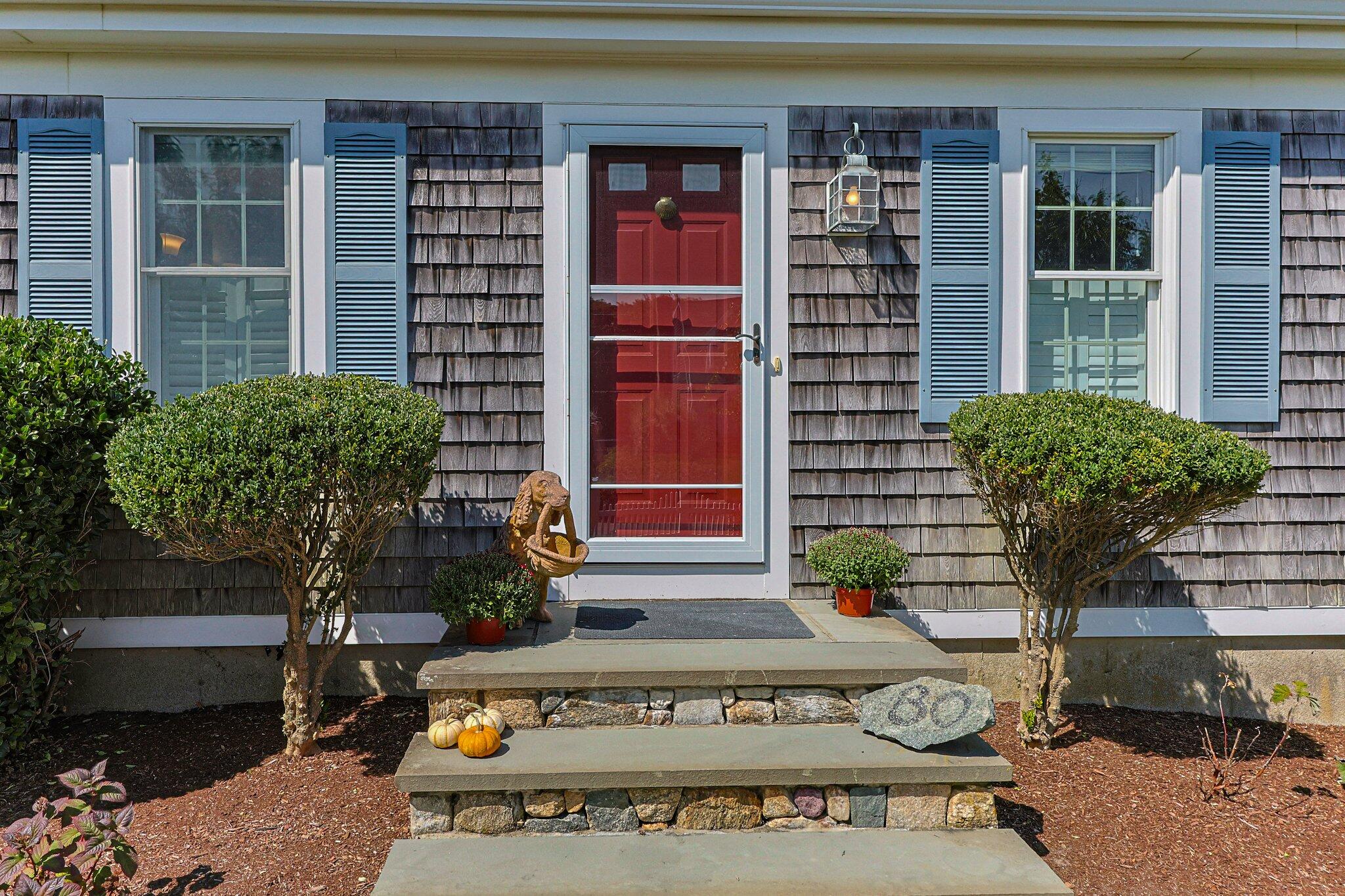 80 Hiram Pond Road Dennis, MA 02638 - Photo 7 of 82 a view of a building with potted plants