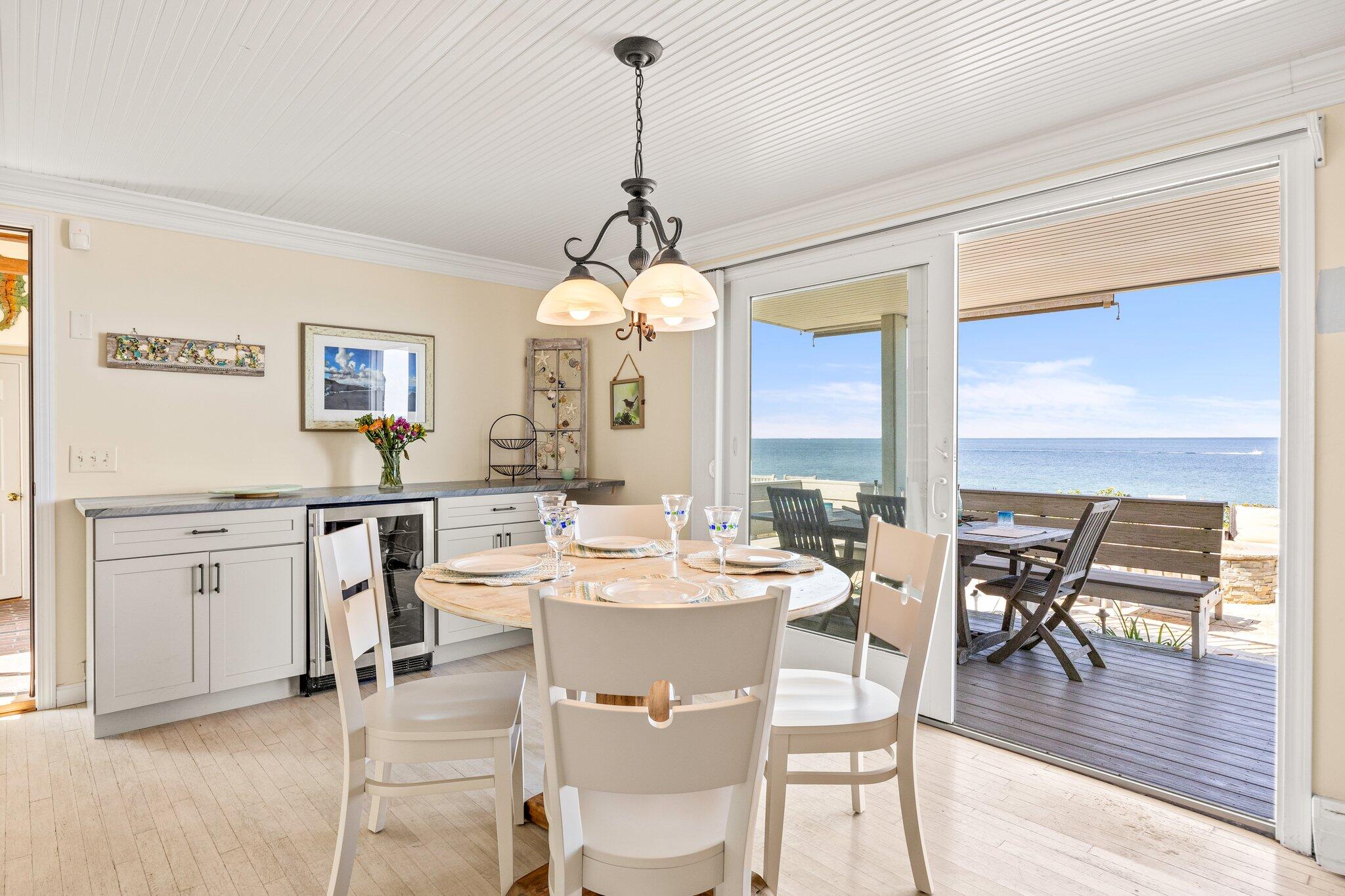 80 Hiram Pond Road Dennis, MA 02638 - Photo 9 of 82 a very nice looking dining room with a large dining table and chairs