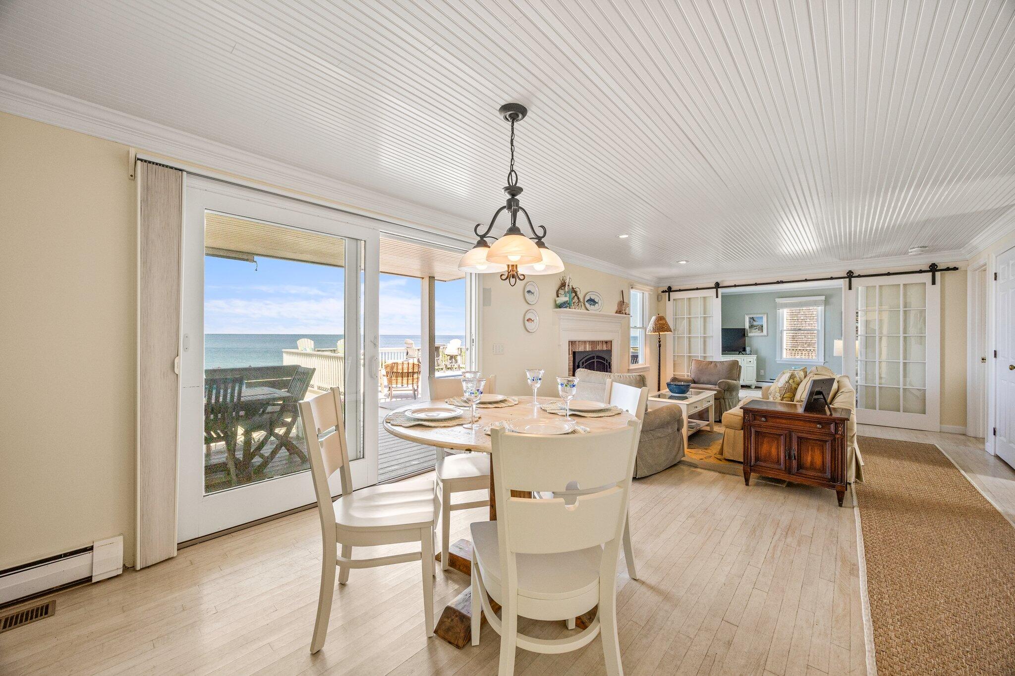80 Hiram Pond Road Dennis, MA 02638 - Photo 10 of 82 a dining room with furniture window and wooden floor