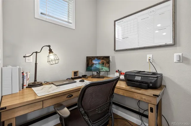 a view of a workspace with furniture