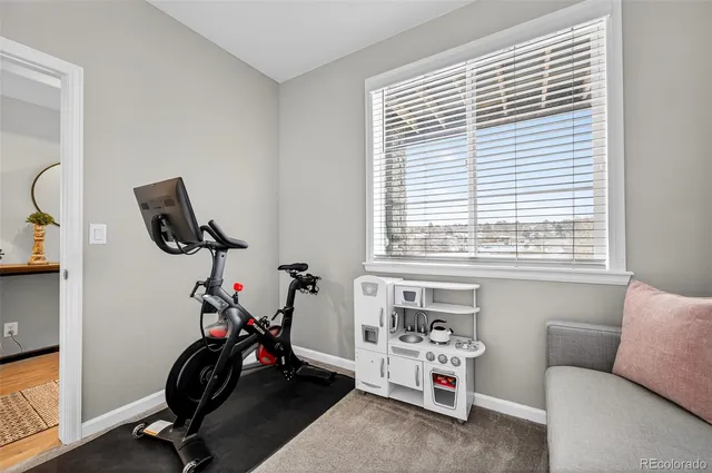 a view of a livingroom with furniture and a window