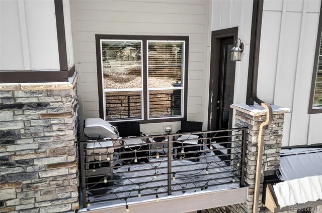 a bathroom with a sink a mirror and next to a window