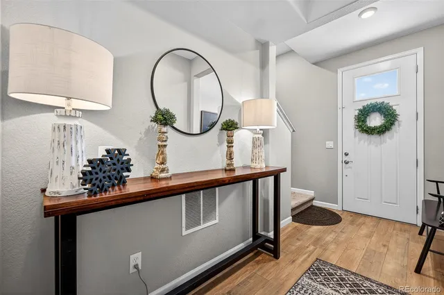 a view of a hallway with paintings on the wall