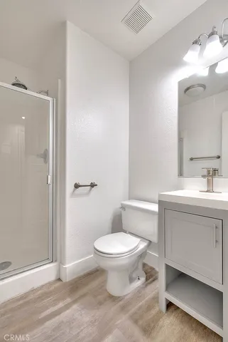 a white toilet sitting next to a bathroom sink