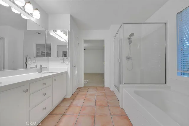 a bathroom with a bath tub and a shower