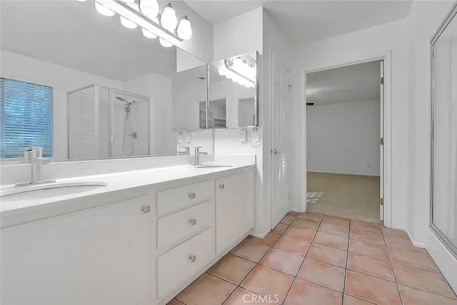 a kitchen with a cabinets and chandelier