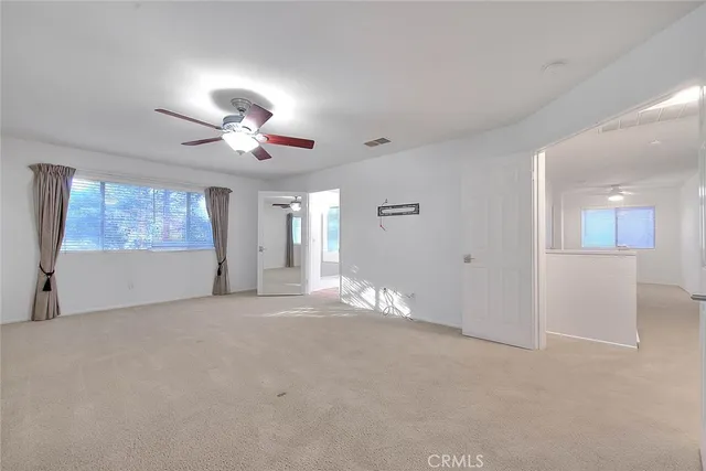 a view of a livingroom with a ceiling fan