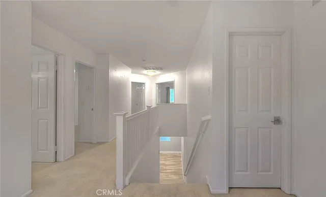 a spacious bathroom with a double vanity sink mirror and a shower