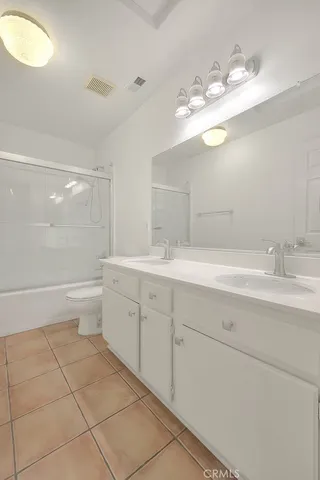 a view of a yard with potted plants